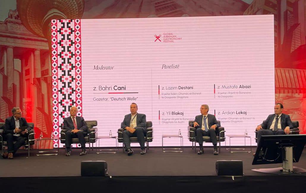 May be an image of 5 people, dais, newsroom and text