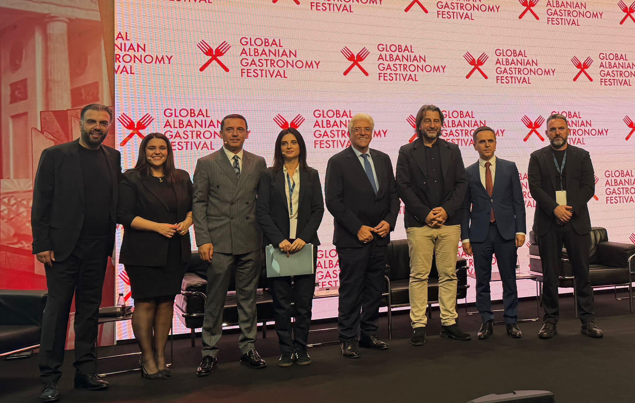 May be an image of 8 people and text that says "FESTIVAL NIAN RONOMY VAL GASTRONOMY FESTIVAL X GLOBAL ALBANIAN GASTRONOMY FESTIVAL ALBANIAN GASTRONOMY FESTIVAL GLOBAL ALBANIAN GASTRONOMY FESTIVAL GLOBAL ALBANIAN GASTRON ESTIVAL GLOBAL ALBANIAN GASTRONOMY FESTIVAL GLOBAL GLOBAL GASTRON FESTIVAL GASTR FESTIVA MY GLOBAL ALBANIAN GASTRO ESTIVA Y Χε CLOBAL ANIAN HRONOMY IVAL GLOBAL GASTRO FESTIVA GLO ALBA GAS EST M"